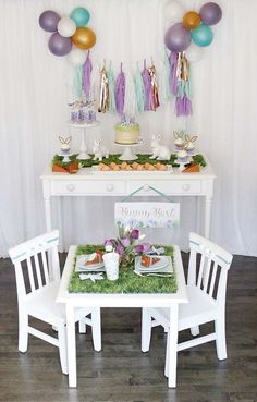 a table set up for a baby's first birthday