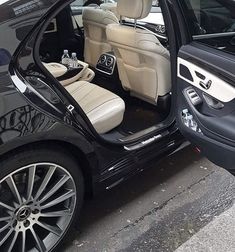 the interior of a car with its door open