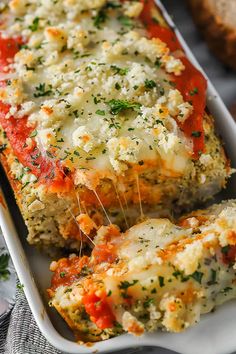 a casserole dish with meat and cheese on it, ready to be eaten