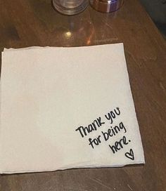 a napkin that says thank you for being hero on it sitting on a wooden table