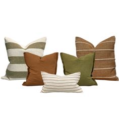 four different colored pillows sitting next to each other