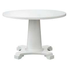 a white round table with pedestals on each side and one end at the base