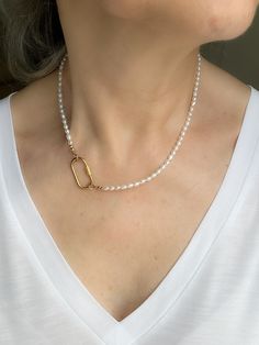 Add a touch of elegance to your everyday look with this stunning Tiny Rice Pearl Beaded Carabiner Necklace. This choker charm features delicate freshwater pearls meticulously strung together on a 14k gold filled chain. The unique stainless steel carabiner screw lock clasp adds a modern twist to this classic piece of jewelry. Perfect for elevating any outfit, this necklace is sure to become a staple in your collection. * Rice Pearl beads measure 2.5mm - 3.5mm (freshwater pearls) * June Birthstone Elegant Jewelry With Carabiner Clasp, Elegant Gold Necklaces With Carabiner Clasp, Elegant Necklaces With Carabiner Clasp For Gift, Beaded Carabiner, Charm Holder Necklace, Charm Holder, Pearl Gemstone, Pearl Charms, Necklace Sizes