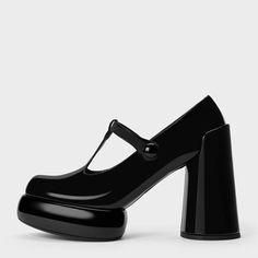 Elevate your style with these Women's Round Toe T-strap Platform Mary Janes. The chunky heel provides comfort and stability, while the T-strap adds a touch of sophistication to any outfit. Color: Black Material: Patent leather Heel Type: Chunky heel Heel height: 4" / 102 mm approx Product measurements were taken using size 8. Please note that measurements may vary by size. Toe: Round toe The black Mary Janes with eye-catching tubular platform soles and chunky cylindrical heels, are bound to turn heads wherever you go. Vintage T-strap design Handcrafted US sizing. Fits true to size. Black Mary Janes With Stacked Heel And Ankle Strap, Black Closed Toe Mary Janes With Stacked Heel, Black Mary Janes With Stacked Heel And Round Toe, Black Mary Janes With Padded Heel, Black High Heel Mary Janes With Stacked Heel, Black T-strap Heels With Padded Heel, Black Mary Janes With Stacked High Heel, Black Mary Janes With Stacked Heel, Black T-strap Mary Janes With Buckle Closure