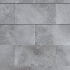 a close up view of a gray tile floor with no grouting on it