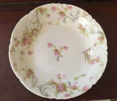 a white plate with pink flowers on it