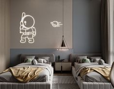 two beds in a room with lights on the wall and lamps hanging from the ceiling