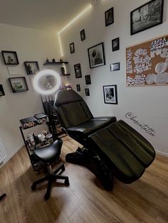 an empty salon room with chairs and pictures on the wall above, along with other items