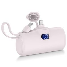 an alarm clock is plugged in to a charger for charging the cell phone