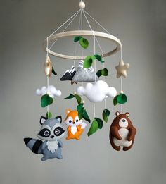 a mobile with animals hanging from it's sides