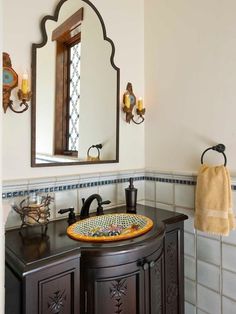 a bathroom with a sink and mirror in it