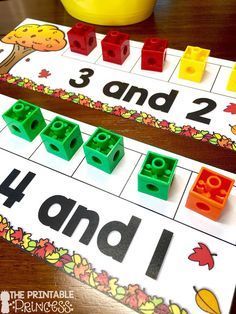 two legos are sitting next to each other on a table with numbers and letters