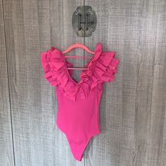 New Condition With Tags Size Large 121 Party Bodysuit With Ruffles, Chic Summer Bodysuit With Ruffles, Chic Pink Swimwear With Ruffles, Chic Ruffled Bodysuit For Vacation, Chic Ruffled Bodysuit For Beach Season, Spring One-piece Swimwear With Ruffles, Chic One-piece Ruffled Bodysuit, Ruffled One-piece Swimwear For Spring, One-piece Ruffled Swimwear For Spring