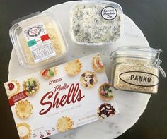 some food is sitting on top of a white plate and next to a package of crackers