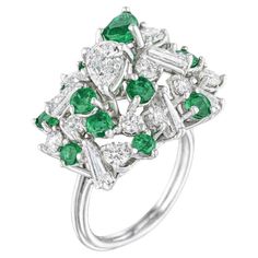 Emerald and diamond cluster ring in Platinum. The details are as follows : Diamond weight : 1.90 carats Emerald weight : 1.50 carats Metal : 18 K white gold Ring size : 4 1/2 Measurements: 3/45x1/2inch, height 5/8inch weight : 8.80 grams Luxury Platinum Cluster Emerald Ring, Dazzling Multi-stone Platinum Diamond Ring, Gia Certified Dazzling Cluster Diamond Ring, Luxury Cluster Emerald Ring With Diamonds, Platinum Multi-stone Cluster Diamond Ring, Platinum Cluster Multi-stone Diamond Ring, Platinum Multi-stone Cluster Ring, Multi-stone Platinum Diamond Ring In Fine Jewelry Style, Fine Jewelry Platinum Multi-stone Diamond Ring