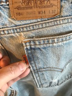 "These are vintage Levi jeans style 550 with zippers and tapered ankles,relaxed fit. They are measured size 33\"/32\".Original size 34\"/32\". These are orange tab,probably from the seventies. They are evenly faded with nice trendy frays,especially on the right knee. Shipping is two day priority in the U.S. And first class everywhere else. Thankyou for visiting my shop. Please come back again! I Also have measured size 32\"/30\" with no holes in great distressed condition. Just got 29\"/32\", 30\"/30\" ,32\"/31\", 32\"/32\" in perfect condition and 36\"/34\" and 32\"/34\"and 34\"/31\". Send me a conversation and lI'll send you a picture. Or pick 550 new sz 29/30 in black . These are new men's jeans. This last black pair is women's 550 vintage ,taper legs sz 27\"/30\" measured." Vintage Levis Jacket, Levis Jean Jacket, Levis 550 Jeans, Levis 550, Vintage Levis Jeans, Levis Jacket, Blue Jean Jacket, Distressed Denim Jacket, Levis Men