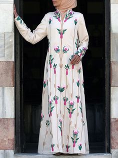 Full length High collar with hidden zipper chest opening Wudu'-friendly hidden zipper cuffs Full embroidered front, back and lower sleeves Model is 168cm (5 feet 6 inches) and wearing size M Item Code: wD2751 Traditional Long Sleeve Abaya For Spring, Fitted Long Sleeve Kaftan With Floral Embroidery, Long Sleeve Maxi Dress With Floral Embroidery For Eid, Long Sleeve Kaftan With Resham Embroidery, Fitted Long Sleeve Abaya With Floral Embroidery, Long Sleeve Embroidered Dress For Eid, Fitted Long Sleeve Embroidered Kaftan, Fitted Long Thobe For Eid, Fitted Floral Embroidery Long Sleeve Abaya