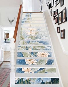 a stair case with flowers painted on it