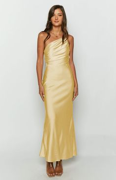 * Yellow Maxi Formal Dress    *     * HOW TO STYLE:   * Be the belle of the ball () at your next event in this stunning yellow satin gown! Featuring a one shoulder strap and gathering throughout the bodice, this maxi dress () is perfect for formals and bridesmaid dresses. Style with dainty gold jewellery () and strappy heels to complete the look!   *     * FEATURES:   * Adjustable asymmetric straps   * Gathered material through bust    * Lined   * Invisible side zip   * Light-weight satin materi Yellow Bridesmaids Dresses, Guest Wedding Dress, Yellow Bridesmaid, Women Robe, Formal Maxi Dress, Formal Ideas, Prom Dress Inspo