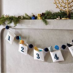 a christmas garland with numbers hanging from it