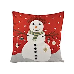 a red pillow with a snowman on it