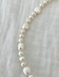 The loveliest pearl necklace! Composed of real, freshwater pearls ranging from 5-9mm and finished off with all gold filled materials. Nickel and lead free. Adjustable 15-17in. Everyday Single Strand Pearl Necklace, Everyday Single Strand Pearl Necklace With Round Beads, Everyday Baroque Pearl Necklace In Pearl White, Everyday Baroque Pearl White Necklace, Everyday Single Strand Baroque Pearl Necklace, White Pearl Necklace For Everyday, Classic Everyday Baroque Pearl Necklace, Everyday White Pearl Necklace, Everyday Pearl Necklace With Pearl Charm