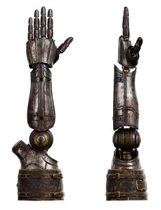 two hand sculptures made out of metal and wood