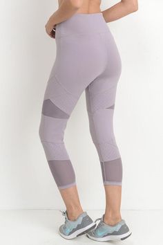 Find your inner 'Ninja Warrior' strength is these dynamic high waisted capri leggings! These leggings feature block panels of solid fabric, dot panels, and mesh panels for an edgy, but still subtle, workout ensemble. Are you ready to take the challenge? Available in lavender 88% polyamide and 12% elastane Imported Purple Nylon Yoga Activewear, Breathable Purple Nylon Activewear, Nylon Activewear With Mesh Sleeves For Workout, Athleisure Sports Activewear With Mesh Sleeves, Mesh Sleeves Activewear, Athleisure Activewear With Mesh Sleeves For Gym, Mesh Sleeve Activewear For Workout, Mesh Activewear With Mesh Sleeves For Workout, Mesh Activewear For Workout With Mesh Sleeves