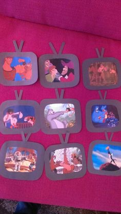 there are many different pictures on this pink table cloth that is made to look like cartoon characters