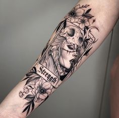 a woman's arm with a tattoo on it that reads stay strong and flowers are around her