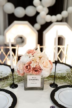 a table with flowers and candles is set up for a formal dinner or reception party