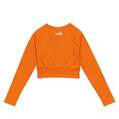 Fall in love with this versatile piece of eye-catching activewear. Our eco-friendly always bright orange cropped rash guard –made with recycled polyester and elastane– is the perfect choice for swimming, sports, or athleisure outfits. The long sleeves and cropped cut provides just enough coverage while the UPF 50+ rated material helps block the sun’s harsh UV rays. Stand out in confidence and comfort all year long in our “wear anywhere” cropped top. .: Made with 81% REPREVE recycled polyester, 1 Cropped Rash Guard, Sweat Workout, Tangerine Orange, Swim Shirts, Leggings Sale, Athleisure Outfits, Athleisure Wear, Compression Leggings, Active Women