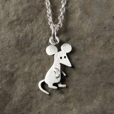 "This funny little mouse is made of sterling silver.  The pendant is TINY, measuring about 1/2\" tall (1.6 cm).  So cute! You can purchase just the pendant/charm, or complete the necklace with a sterling silver chain.  For the matching mouse earrings: www.etsy.com/listing/255999437/tiny-mouse-earrings © Stick Man Creations This is our own original design, handcrafted by us, and signed on the back with our logo.   For more information about the creative process, click here:  www.etsy.com/shop/Sti Mouse Earrings, Stick Man, Little Mouse, The Creative Process, Necklace Sterling Silver, Sterling Silver Chain, Creative Process, Sterling Silver Chains, Original Design