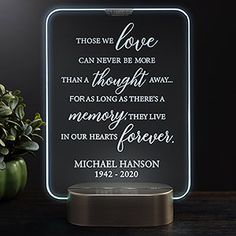 a lighted sign with the words those we love can never be more thought than a long as there's a memory in our hearts forever