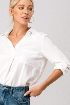 White v neck shirt with collar, turn up sleeves and front pocket. Sleeves can also be worn long when unrolled. This versatile shirt looks great under a blazer for work, or, denim for a smart casual look. Regular fit True to size Material Viscose and lyocell blend Machine washable Perfect White Blouse, Shirt With Collar, Local Color, Classic White Shirt, V Neck Shirt, Popover Shirt, Collar Blouse, Turn Up, Neck Shirt