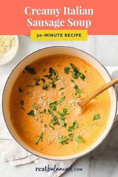 creamy italian sausage soup in a pot with parsley on top and text overlay that reads, creamy italian sausage soup 30 - minute recipe