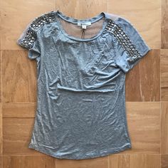 Adorable Gray Tee With Mesh Detail Low V Back And Beading. Nwt. Some Of The Beads Are A Little Scratched. Size Medium But Would Fit A Small As Well Spring Fitted Embellished T-shirt, Casual Embellished T-shirt For Party, Casual Party Tops With Rhinestones, Casual Fitted Embellished Blouse, Beaded Short Sleeve Tops For Summer, Beaded Short Sleeve Tops For Spring, Spring Beaded Short Sleeve Top, Fitted Beaded Short Sleeve Tops, Lakers T Shirt