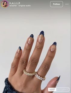 Twinkle, twinkle, Christmas star! 🌟 These navy French-tip nails with delicate gold star accents are the perfect festive manicure for the holiday season. They pair beautifully with gold statement rings to elevate your Christmas party looks.  #NailArtForChristmas #Christmasnails #xmasnails #winternails #novembernails #winteroutfits Christmas Stars Nails, Holiday Accent Nail, Navy And Gold French Tip Nails, Navy Blue Snowflake Nails, Navy Snowflake Nails, Christmas Star Nails Design, Christmas Nails Navy Blue, Navy Holiday Nails, Star Christmas Nails