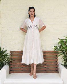 White Embroidered Silk Maxi Dress at Kamakhyaa by Taro. This item is Best Selling, Dusk To Dawn, Embroidered, Evening Wear, FB ADS JUNE, July Sale, July Sale 2023, Midi Dresses, Modal silk, Natural, Regular Fit, Shirt Dresses, Silk, White, Womenswear Cheap Cotton Dresses With Embroidered Hem, White Frock, Short Frocks, Stylish Kurtis Design, Embroidered Shirt Dress