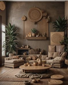 a living room filled with furniture and potted plants