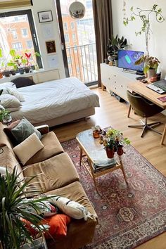 a living room filled with furniture and a flat screen tv