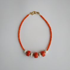 < Orange and white coral beaded necklace > This product made according to the model of authentic traditional Ukrainian jewelry. The coral is modern, the design is vintage. Like 99% of the coral on the market these days, this coral has been dyed. I use bamboo coral which is not endangered or threatened in any way, unlike natural pink or red coral (the production of which is forbidden almost everywhere in the world). Bamboo coral doesn't mean it's not organic. Every bead of it has a distinct Orange Red Coral Beads For Jewelry Making, Coral Polished Beaded Necklaces, Coral Polished Beaded Necklace, Artisan Coral Beaded Necklace Handmade, Handmade Artisan Coral Beaded Necklaces, Orange Red Coral Beaded Necklaces With Large Beads, Artisan Handmade Coral Beaded Necklace, Orange Red Coral Beaded Necklace With Large Beads, Orange Beaded Necklace With Large Red Coral Beads