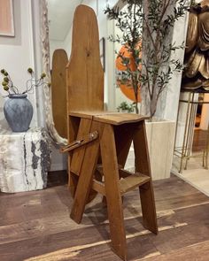 a wooden chair sitting on top of a hard wood floor