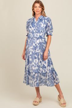 Blue Floral Ruffle Accent Button Up Maternity Midi Dress Ruffle Hem Button-up Dress For Daywear, Button-up Ruffle Hem Dress For Daywear, Button-up Dress With Ruffle Hem For Daywear, Daywear Button-up Dress With Ruffle Hem, Button-up Ruffle Dress For Casual Wear, Elegant Flowy Dress With Button Closure, Blue Flowy Button Dress, Flowy Blue Buttoned Dresses, Flowy Blue Dress With Buttons