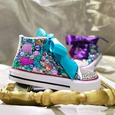 Dive into a world of enchantment with our Mermaid Handmade Pearl Sneakers! These stunning sneakers are designed to make your little one feel like a magical mermaid. The standout feature of these sneakers is the handmade pearl decoration that adorns the top. Each pearl is carefully crafted and placed, creating a beautiful and unique design that captures the essence of underwater wonder. Your little girl will feel like she's walking on pearls with every step she takes. The mermaid theme continues