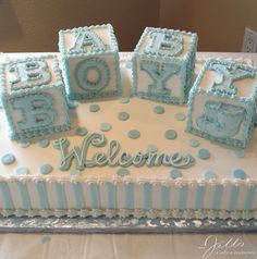 a baby shower cake with blue and white decorations