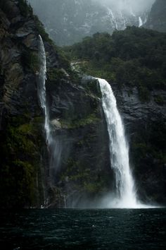 there is a very tall waterfall in the water