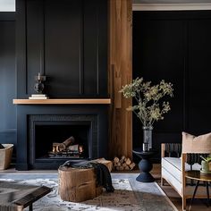 a living room filled with furniture and a fire place next to a wall mounted fireplace