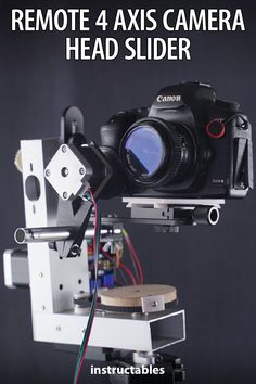 a camera mounted on top of a tripod with some wires attached to the back