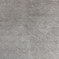 an area rug that has been made in grey tones